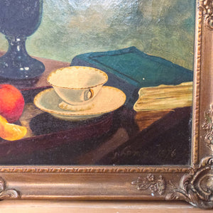A 19th century still life oil painting signed “G Lance 1876,” showing floral and fruit elements in a restrained, classic composition, housed in a traditional gilt frame for immediate display.
