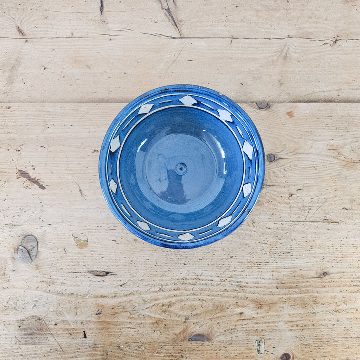 Studio pottery blue bowl with white accents