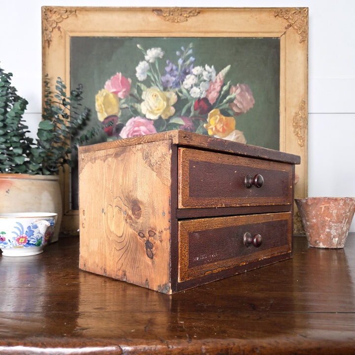Victorian antique pine drawers with two drawers and wooden knobs, finished in their original painted surface. The piece works well as a small chest of drawers in rustic or farmhouse interiors.