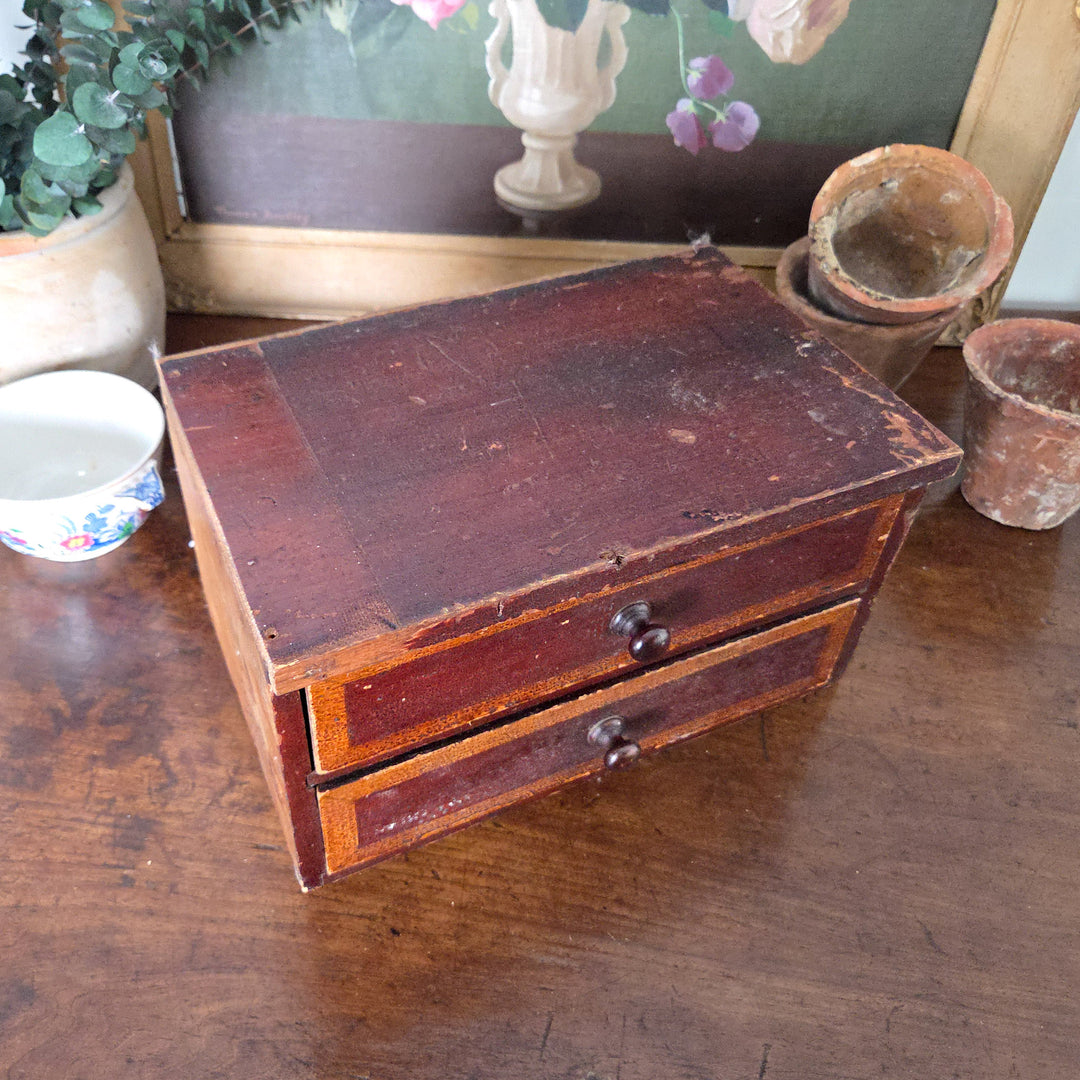 Victorian drawers with two painted drawer fronts in ochre and brown tones, simple knobs and exposed pine to one side. Once part of a larger set, now a characterful piece for country house style rooms.