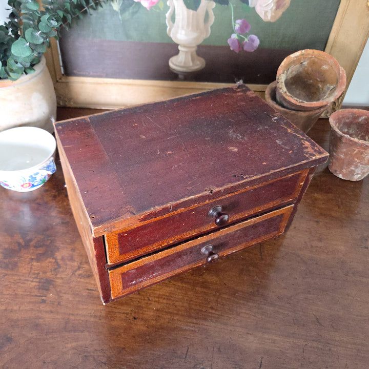 Victorian drawers with two painted drawer fronts in ochre and brown tones, simple knobs and exposed pine to one side. Once part of a larger set, now a characterful piece for country house style rooms.