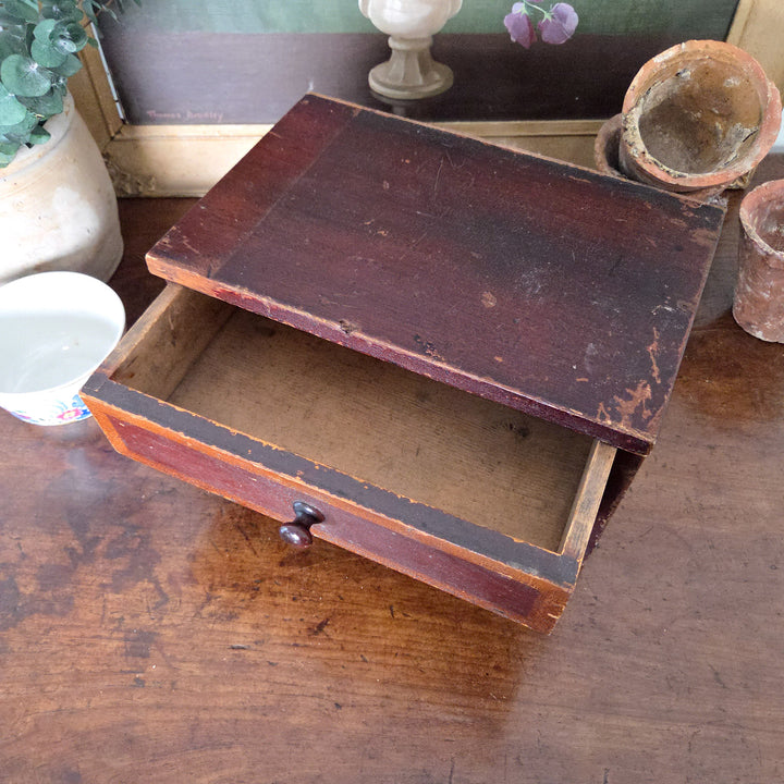 Antique pine furniture from the Victorian period, featuring two drawers and original paint. Compact and practical, these antique storage drawers fit seamlessly into rustic decor spaces.