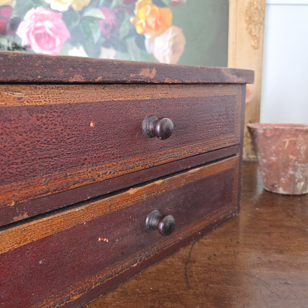 Victorian furniture in pine with original painted finish and two drawers, one side revealing exposed pine where it joined another set. Ideal antique storage drawers for a rustic decor scheme.