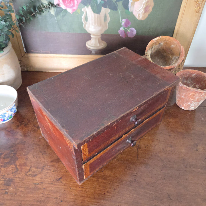 Antique Victorian pine drawers with simple knobs and painted surfaces, showing natural wear from use. A decorative small chest of drawers suited to farmhouse style interiors.
