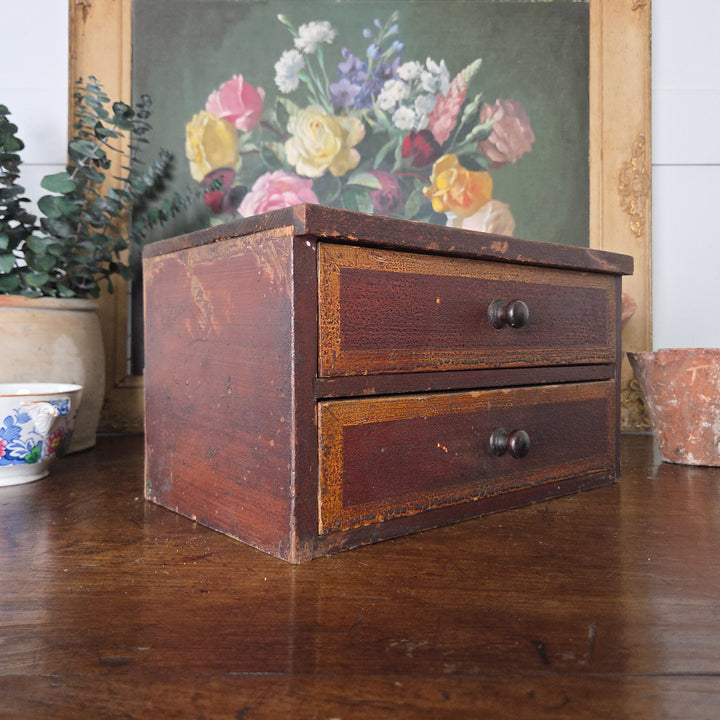 Victorian drawers in pine with original paint and ochre detailing. This antique tabletop chest offers practical storage and adds warmth to country house style or antique home decor.