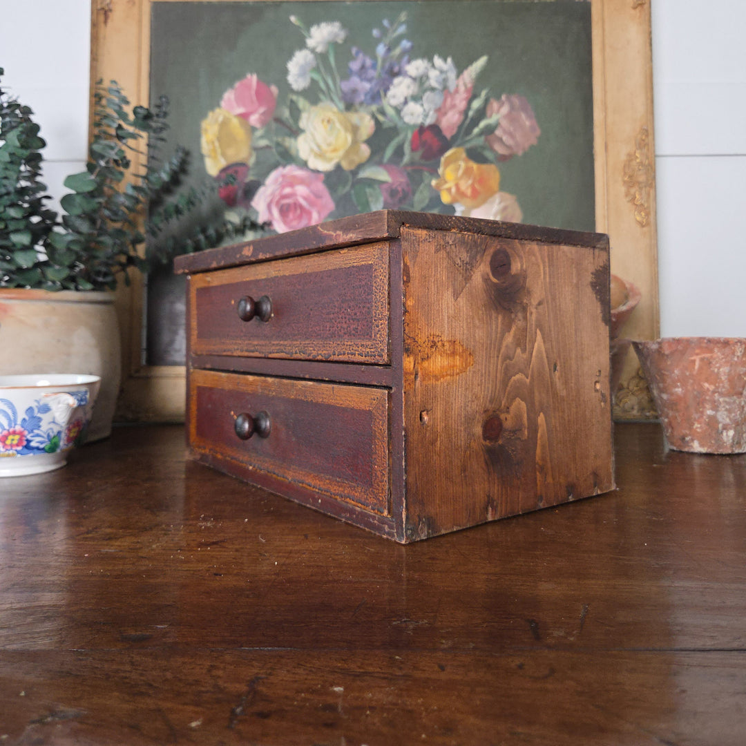 Antique pine drawers from the Victorian period with two drawers and turned knobs. The warm colours and aged surface make them ideal for farmhouse style or rustic interiors.