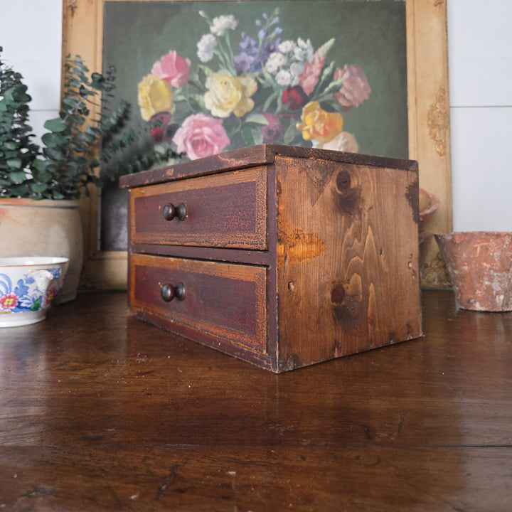 Antique pine drawers from the Victorian period with two drawers and turned knobs. The warm colours and aged surface make them ideal for farmhouse style or rustic interiors.