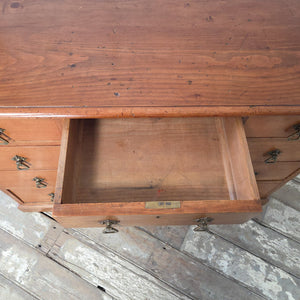 Late Victorian cherrywood desk with a central cupboard interior shelf and plinth base