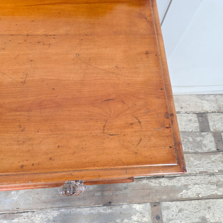 Antique Victorian chest of drawers in mahogany with two short drawers over two long, retaining original glass knobs and bun feet, shaped upstand to the top, a practical 19th century four drawer chest with a deep bottom drawer providing storage for clothing, linens, or household essentials.
