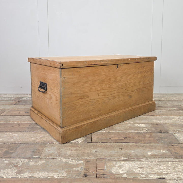 A rustic Victorian pine storage chest with hinged lid and internal drawers, made from solid pine and sealed in clear wax. A practical antique trunk or blanket box that offers versatile farmhouse storage for household use.