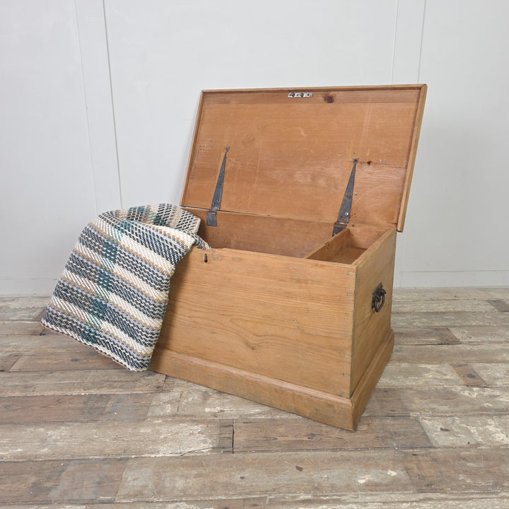 Victorian pine blanket box with hinged lid, internal drawers and candle box. Finished in clear wax to enhance the tone of the timber, this antique storage chest or rustic trunk also suits use as a toy box or farmhouse coffee table.