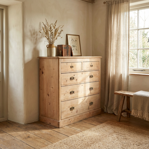 A 19th century Victorian pine chest of drawers featuring five drawers and decorative brass handles. With a stripped pine finish, this country style chest works well as bedroom drawers or as a sideboard for storage.