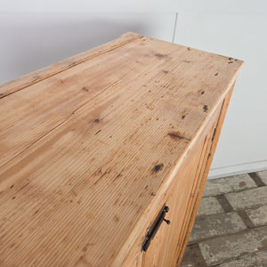 Rustic Victorian pine cupboard with two front doors, brass fittings, and a fully shelved interior, finished in stripped pine with farmhouse appeal.

