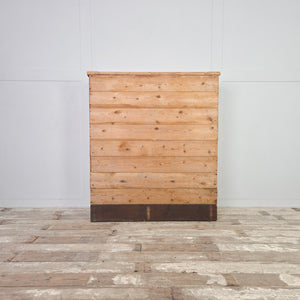 Victorian antique pine cupboard with two doors to the front, brass hardware, and a shelved interior visible when opened.
