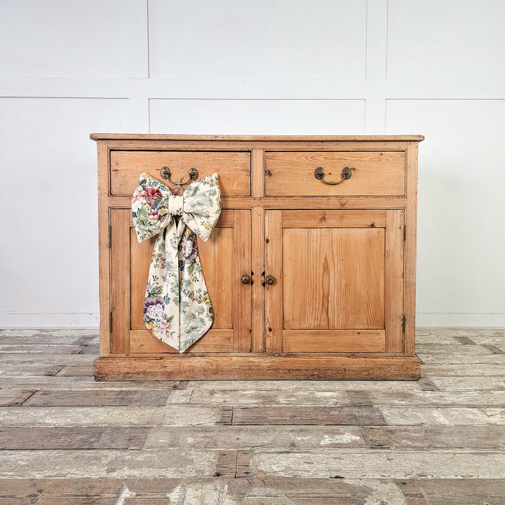 Antique pine cupboard from the 19th century with brass handles