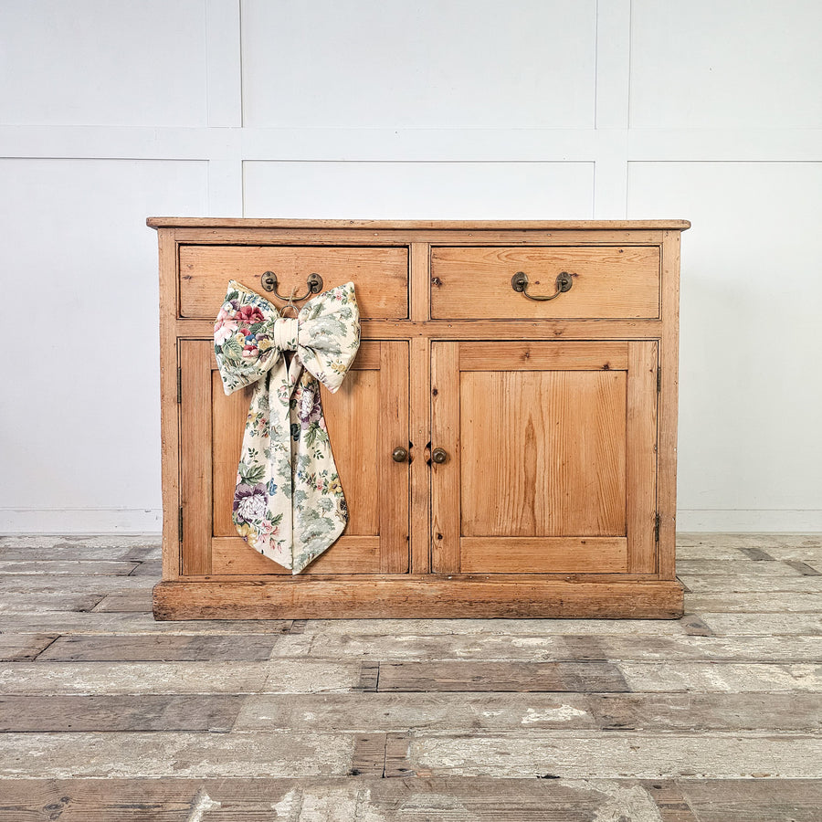 Antique pine cupboard from the 19th century with brass handles