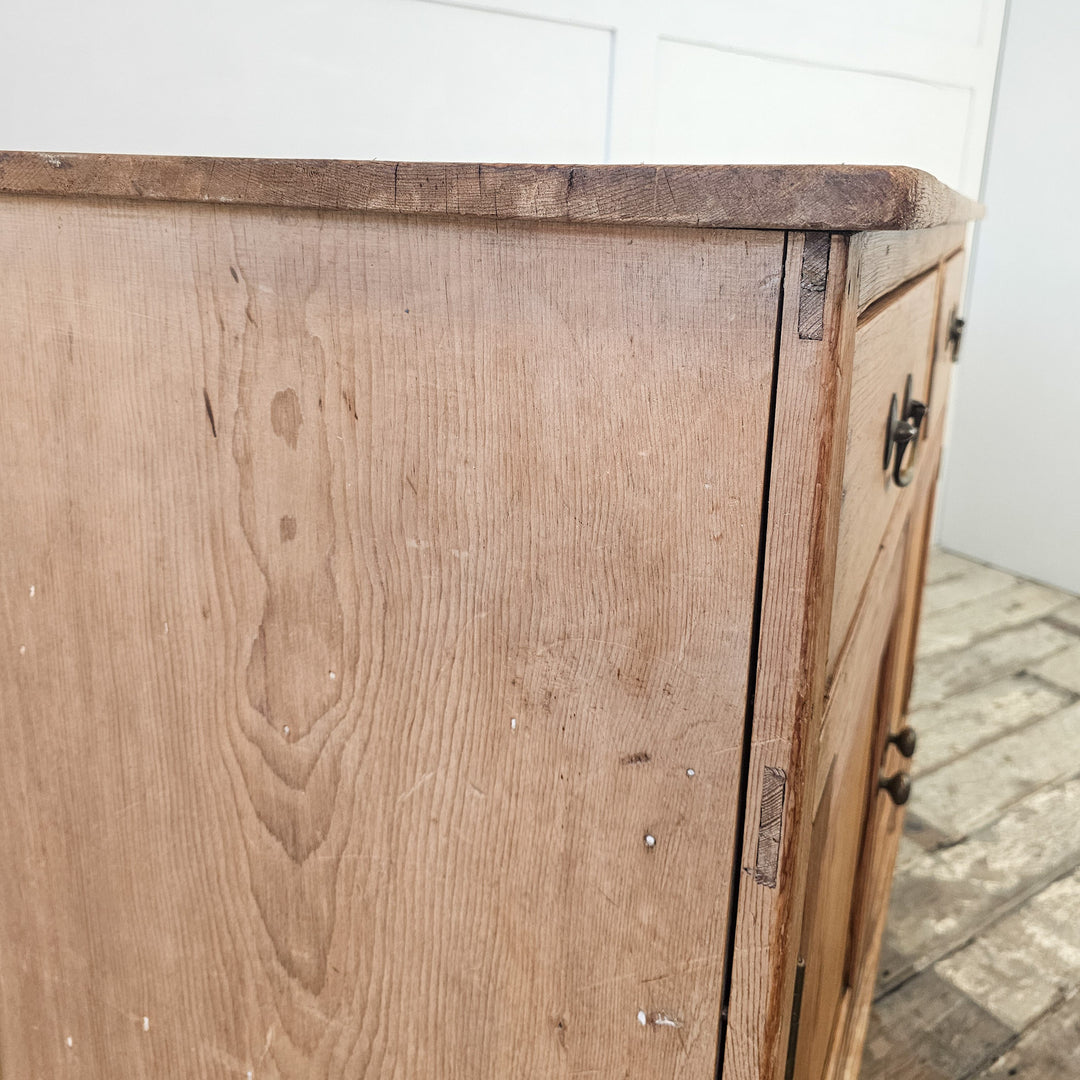 Antique kitchen cupboard in pine with original brass fittings.