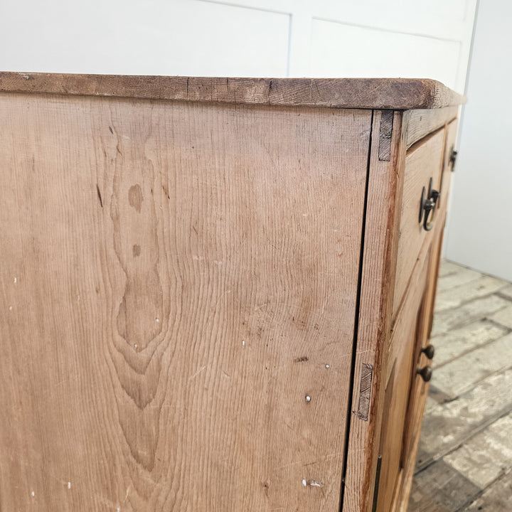 Antique kitchen cupboard in pine with original brass fittings.