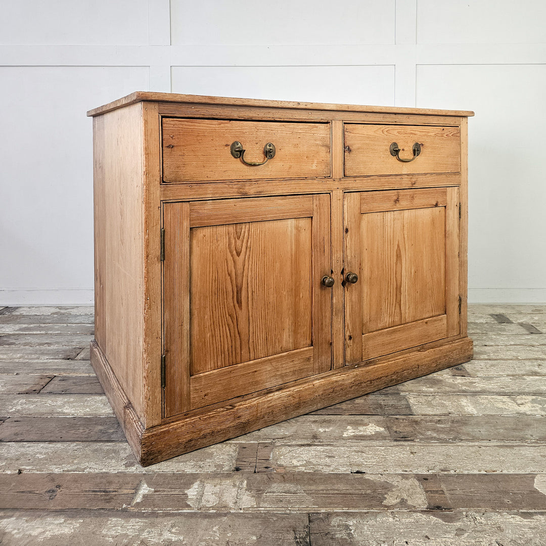 Traditional pine cupboard with functional design and aesthetic appeal.
