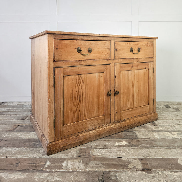 Traditional pine cupboard with functional design and aesthetic appeal.