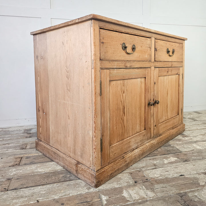 Two-drawer pine cupboard with large compartment doors