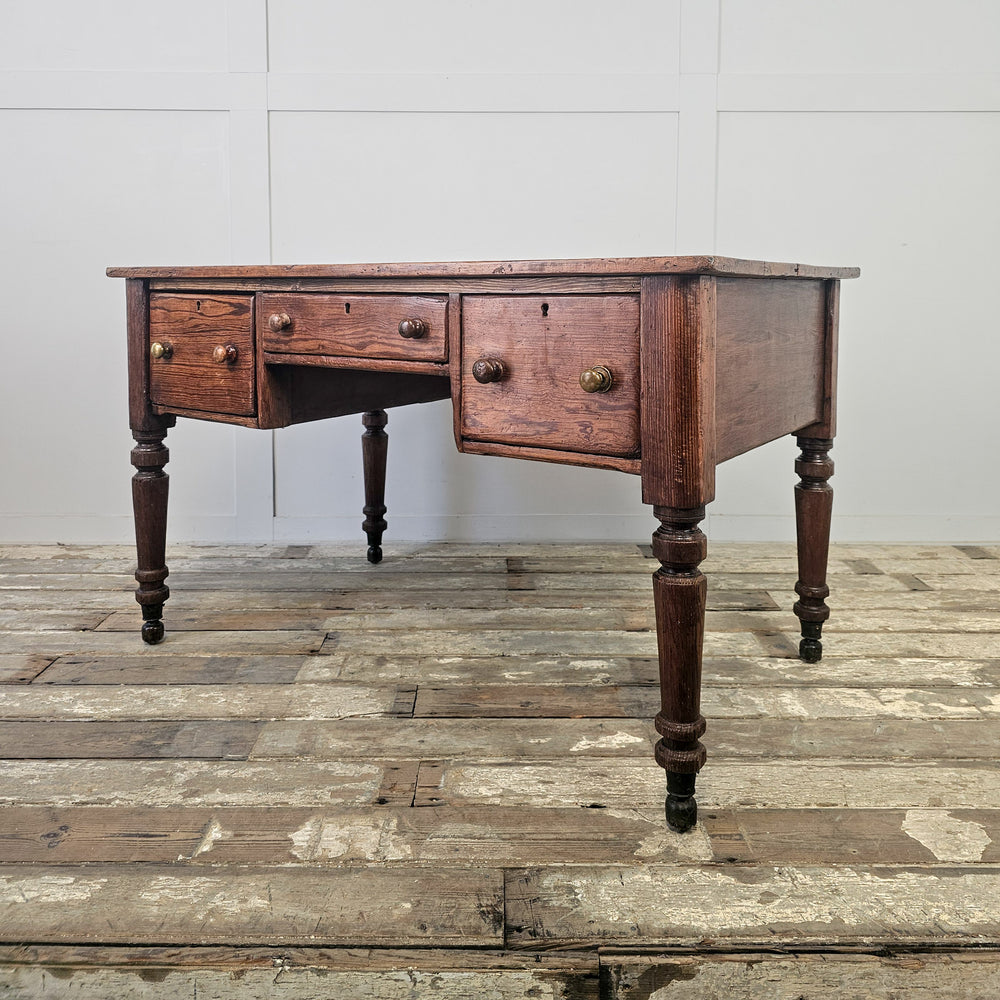 Large antique pine table with central kneehole and drawer layout, suitable for kitchen, hallway or office
