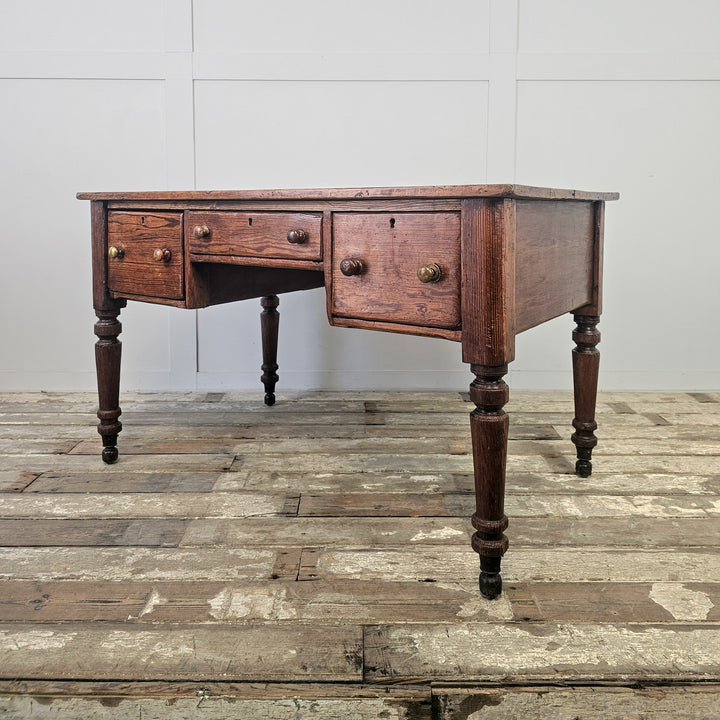 Large antique pine table with central kneehole and drawer layout, suitable for kitchen, hallway or office
