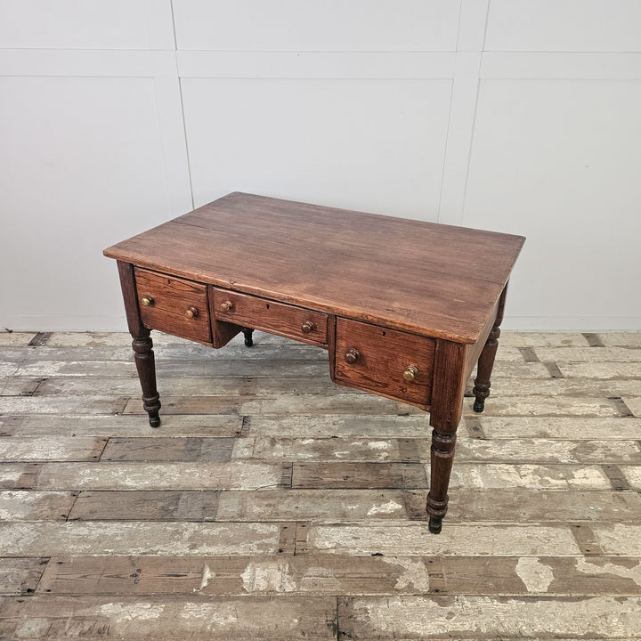 Early 20th century pine table in solid antique wood with shaped legs and deep surface for practical use
