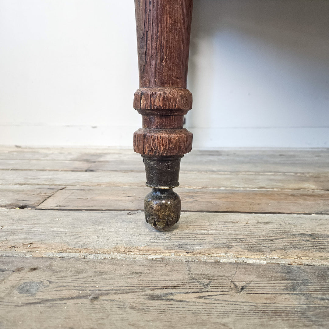 Large antique table with drawer configuration to the front and practical proportions for home use
