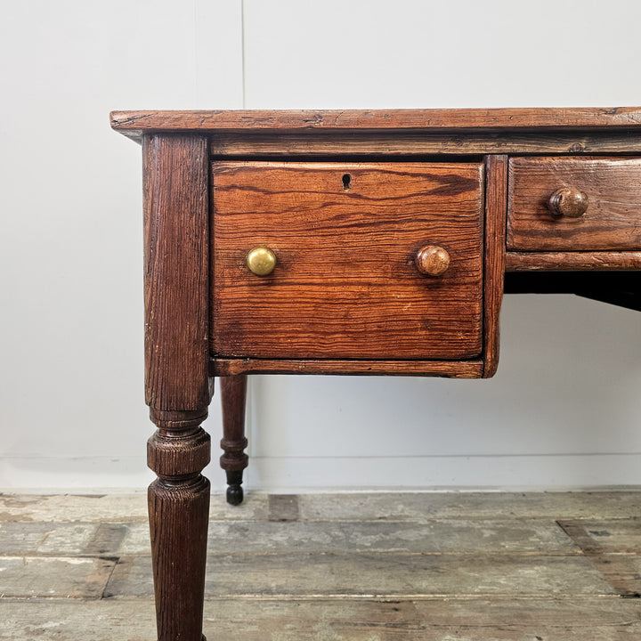 Antique pine table with functional storage drawers and solid farmhouse design for everyday use
