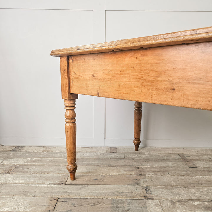 large pine table with storage drawers and apron
