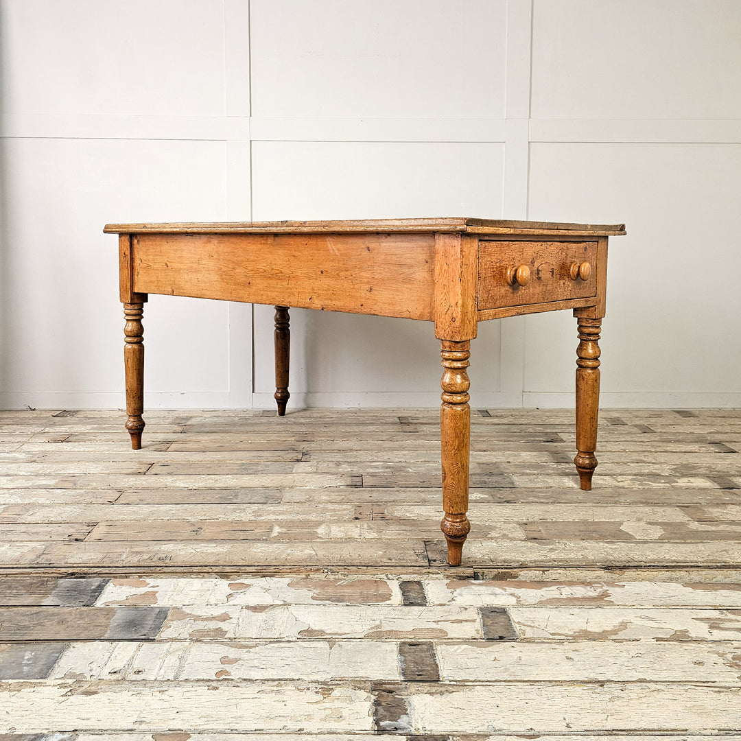pine dining table with two drawers and wooden knobs
