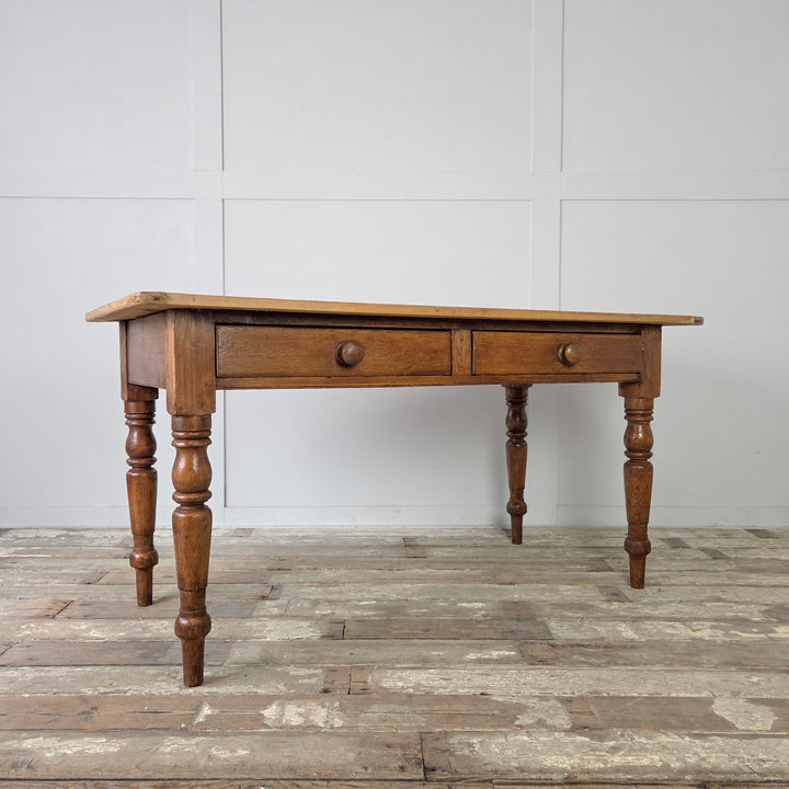 Victorian pine prep table with a three-plank top, cleated ends, and practical storage drawers, an authentic farmhouse kitchen table from the 1800s.
