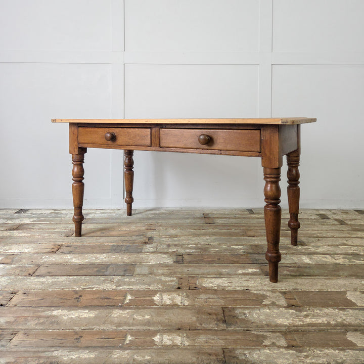 19th century Victorian pine table, ideal for kitchens or dining spaces, featuring traditional joinery, original knobs, and solid pine construction.

