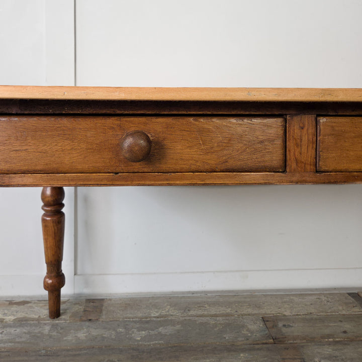 Victorian pine table, original wooden knobs, turned legs, and two practical drawers, antique farmhouse piece for kitchens or dining rooms.
