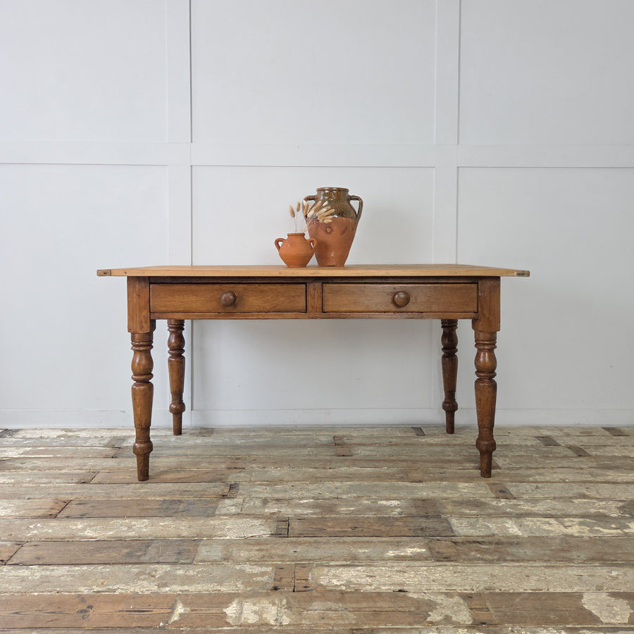 Victorian pine kitchen prep table with turned legs and two drawers, 19th century farmhouse style, antique pine table with traditional details and original wooden knobs.
