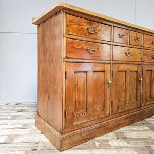 Pine dresser with three spacious cupboards.
