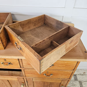 Functional pine dresser with multiple storage options.