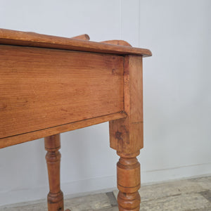 Victorian antique pine washstand featuring scroll gallery back, shaped lower shelf and turned legs. An authentic 19th century piece, versatile as a farmhouse console or rustic side table, finished in waxed pine to enhance the natural colour and texture of the antique wood.