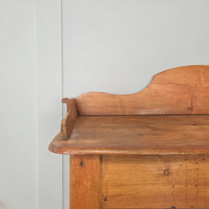 19th century Victorian pine washstand, raised on four turned legs with scroll-sided gallery back and shaped lower shelf. A versatile antique pine piece suited to farmhouse interiors, offering use as a rustic console table, hall side table or classic country washstand.