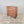 Antique pine chest of drawers with five graduating drawers, original paintwork, and four dark contrasting bun feet
