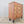Antique painted pine chest of drawers with five graduating drawers and matching turned wooden knobs throughout
