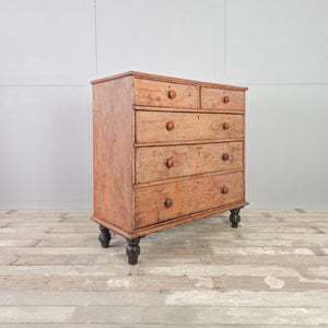 Victorian pine five drawer chest with original buttermilk painted finish and four contrasting dark bun feet below
