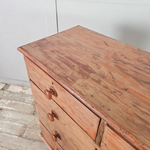 Antique five drawer pine chest of drawers with original buttermilk painted finish and four dark contrasting feet