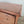 Victorian pine chest of drawers with original buttermilk painted finish and four dark contrasting bun feet below

