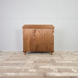 Traditional Victorian pine furniture with original glass knobs and a light natural patina.
