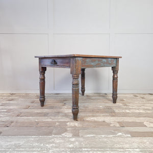 Antique pine table with a chippy blue-green painted base and a waxed three-plank top
