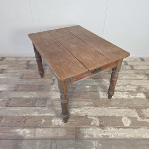 19th century pine dining table with an apron drawer fitted with an ornate cast iron handle