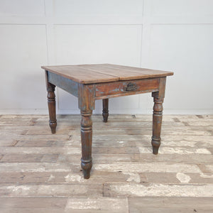 Victorian farmhouse table in pine with a waxed planked top and a distressed painted base
