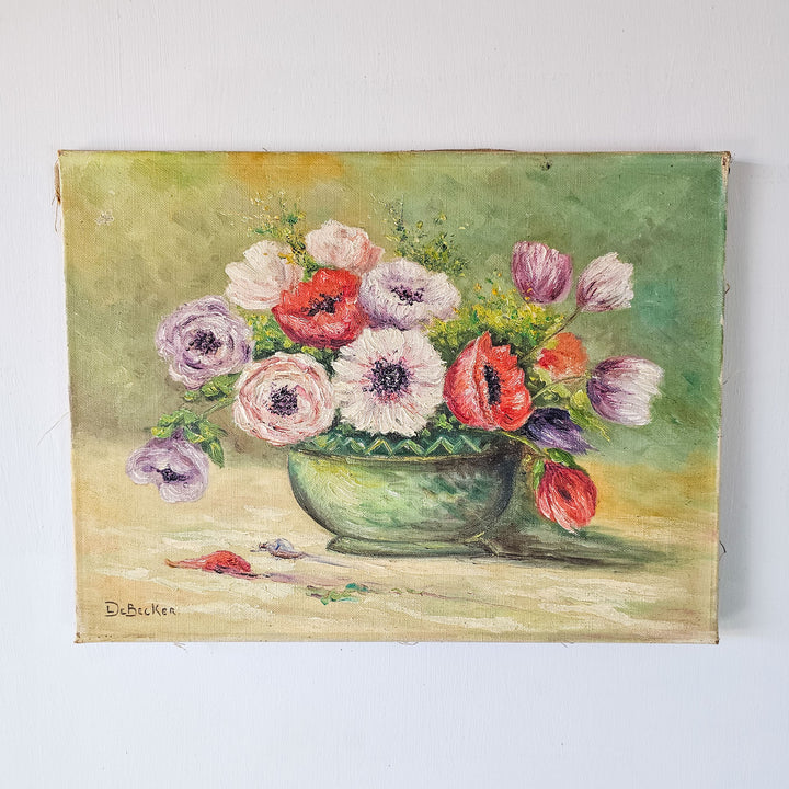 lose-up view of a vintage floral oil painting by De Becker, featuring a lush array of multicolored flowers in a green bowl against a muted background